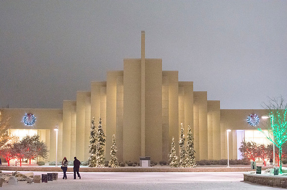 Christmas lights aglow with new snow shine bright around the BYU-Idaho Taylor Building