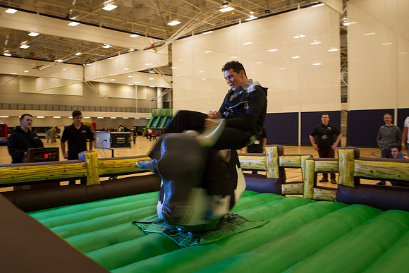 Students ride the bull as part of the festivities during I-Night.