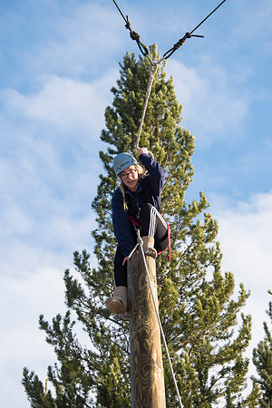 Student, Brittany Tanner, climbs up the Power Pole during iGrow.