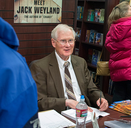 Author, Jack Weyland has a book signing during the Employee Christmas Sale.