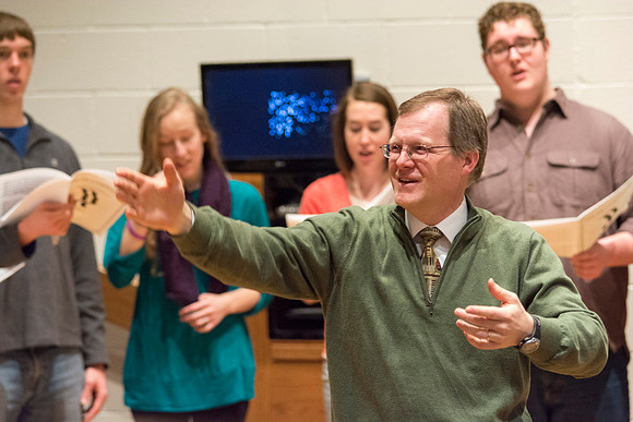 Randall Kempton instructs the talented students who make up the Collegiate Singers at BYU-Idaho.