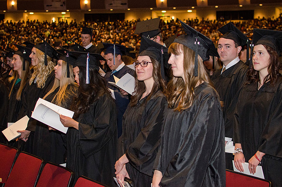 Graduates make their way to their seats.