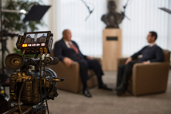 President Wilkes chat's with video production student before President Gilbert arrives.