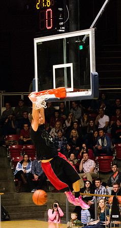 A student making an amazing basketball dunk.