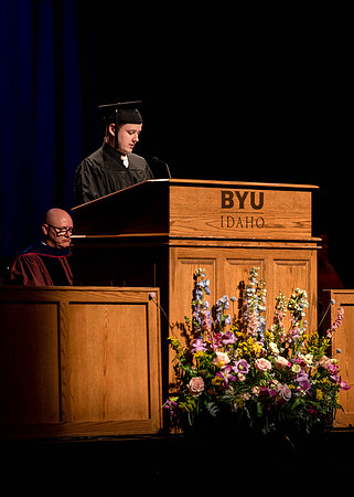 Students graduate and walk to receive their diplomas during convocation in the College of Physical Sciences and Engineering.