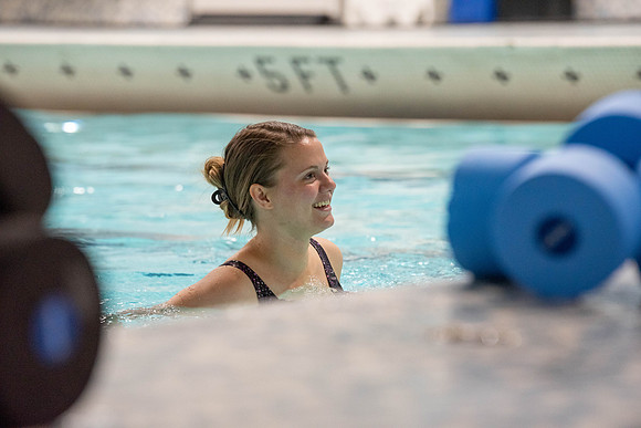 Students workout together in the pool at the Hart Building. Water Areobics Class taught by an instructor.