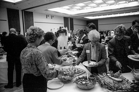 Guests at the President's Club Banquet get food