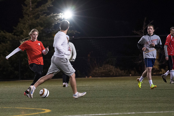 Co-Ed Intermediate Soccer teams play game.