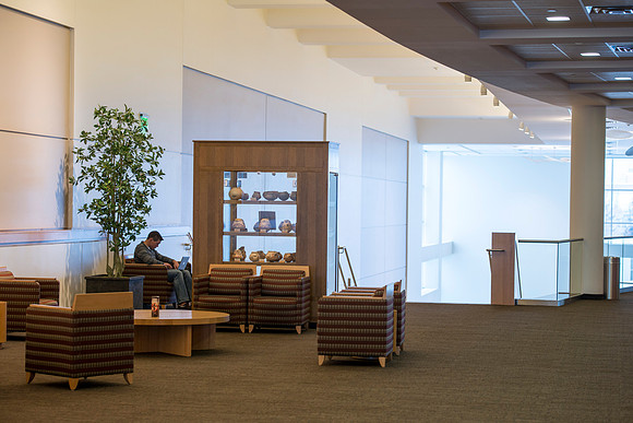A student seeks a quiet place to study on campus in the I-Center.