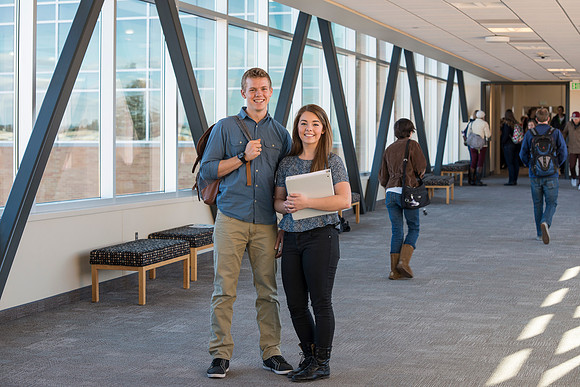BYU-Idaho students, Collin and Martina in the Skywalk between the Manwaring Center and the McKay Library.