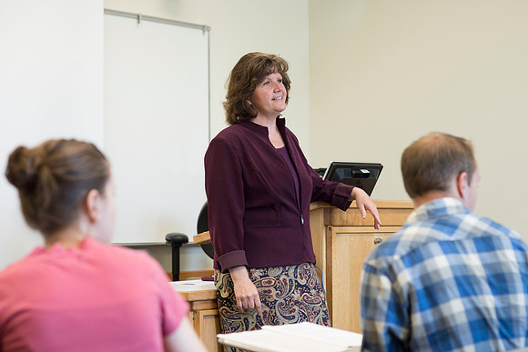 Sister Brooke McKenna teaches students in a communication class.