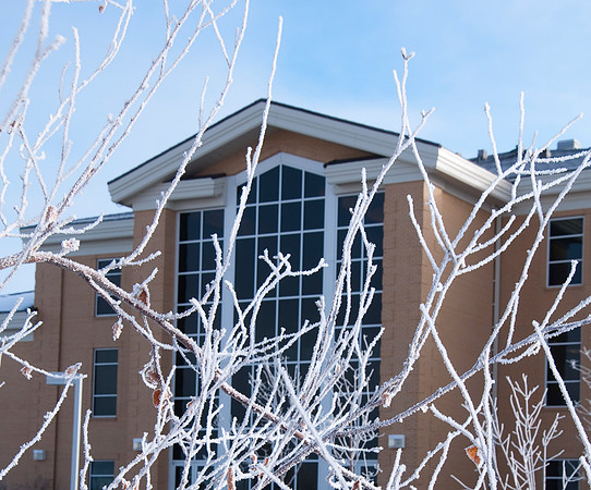 Hinckley building on winter morning. Students walking to class.