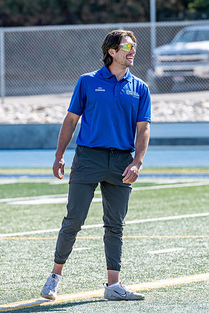 Coaches teach younger kids ages 12-16 exercise drills on the BYU-Idaho stadium field at a speed and agility camp.