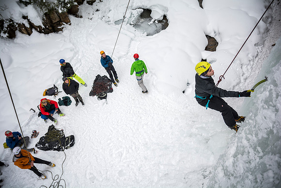 Ashlyn Cuneo, a local from Idaho Falls, climbs with students on an Outdoor Activities ice climbing trip.