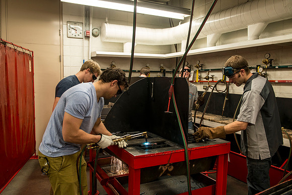 Students from the welding program, work on projects during class in the Austin Building.
