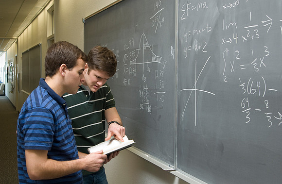 Mike Tripp and Richard Smith working on some Math equations.