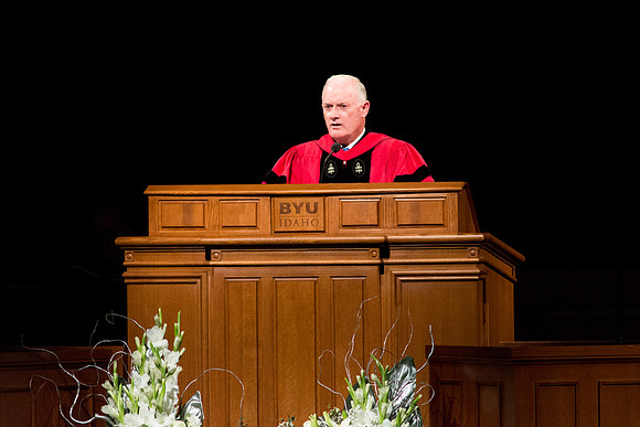 Elder Kim B. Clark giving a speech to the graduates at Commencement