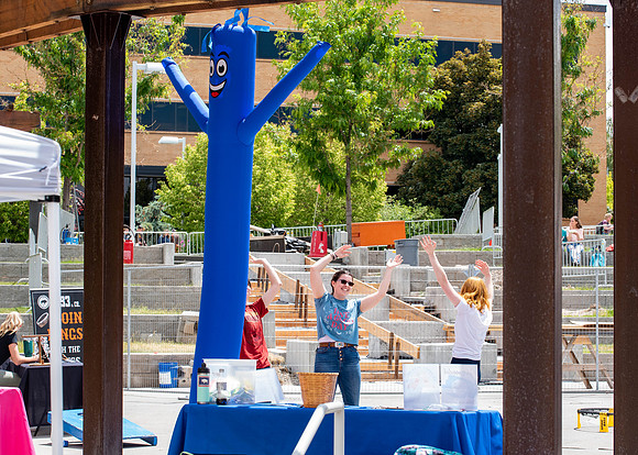 Students get free hot dogs, and enjoy activities at the Amphitheatre. IBC Business sell their products.