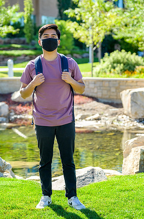 Student volunteers show the way to stay safe during this COVID 19 pandemic by social distancing, following pathway arrows and proper wearing of masks .