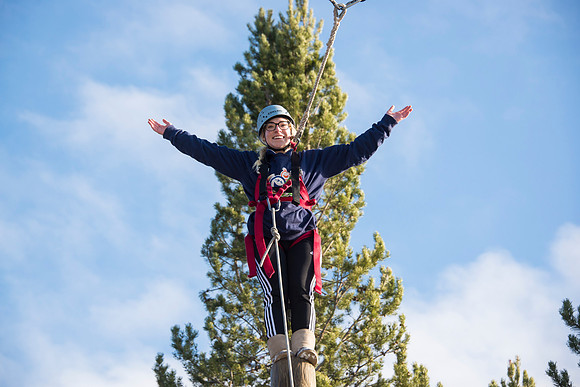 Student, Brittany Tanner, climbs up the Power Pole during iGrow.