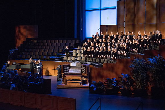 The BYU-Idaho Women's Choir performs "Dear to the Heart of the Shepard" accompanied by paino and flute.