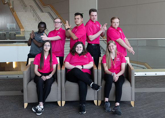 Students who are a part of the Campus Life organization take group photos.