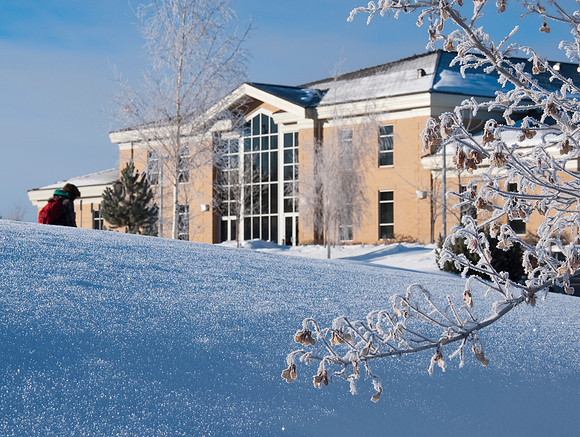 Hinckley building on winter morning. Students walking to class.