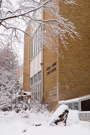 George S. Romney Building blanketed in a winter snow.