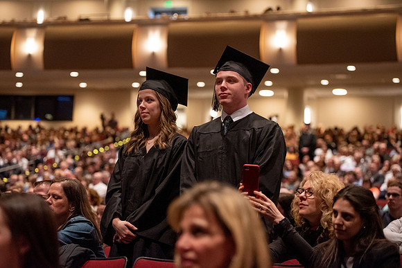Student Graduates and Faculty meet in the I-Center for Commencement.