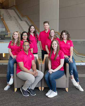 Students who are a part of the Campus Life organization take group photos.