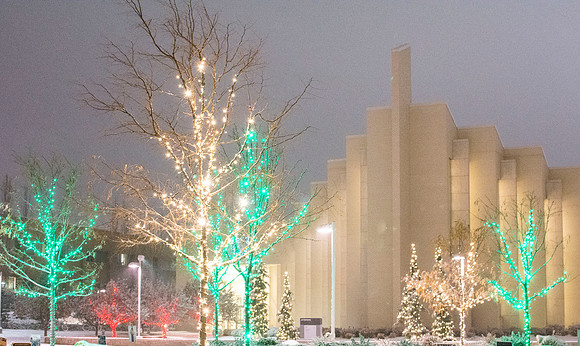 Christmas lights aglow with new snow shine bright around the BYU-Idaho Taylor Building