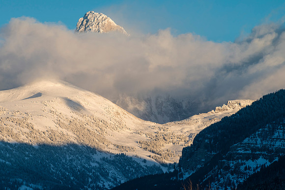 Tetons shrouded in clouds.