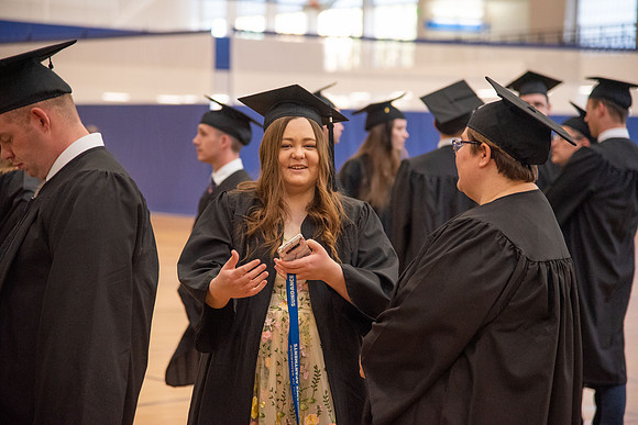 Student Graduates and Faculty meet in the I-Center for Commencement.