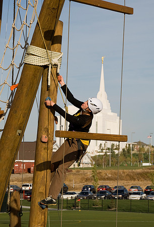 Abby Stevens climbing the Tower with the Rexburg Temple in the background.