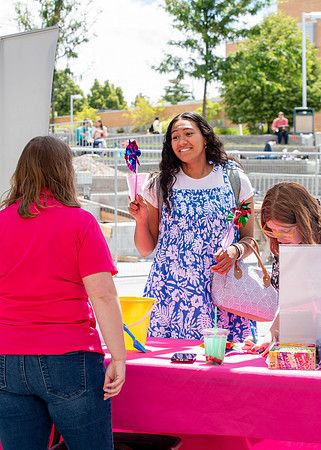 Students get free hot dogs, and enjoy activities at the Amphitheatre. IBC Business sell their products.