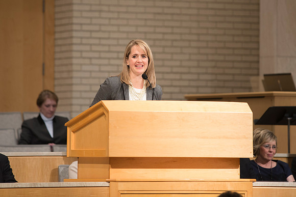 Sister GIlbert introduces Sister Bednar in A Gathering for Women in the Taylor Chapel.