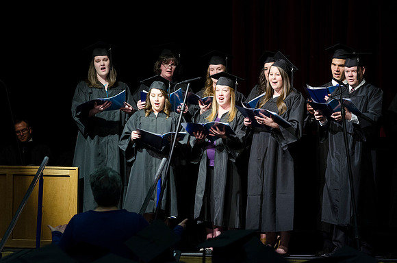 Graduate choir from the College of Business and Communication sings How Firm a Foundation during Convocation in the Hart Auditorium.