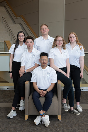 Students who are a part of the Campus Life organization take group photos.