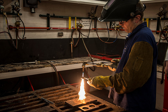 Students from the welding program, work on projects during class in the Austin Building.