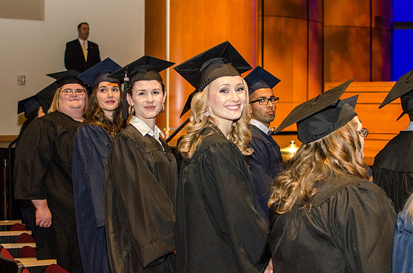 Graduates make their way to their seats.