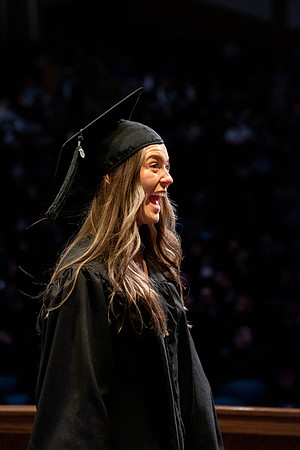 Students graduate and walk to receive their diplomas during convocation in the College of Physical Sciences and Engineering.