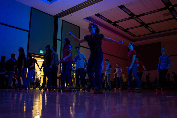 Students rollerblade during I-Night in the MC Building.