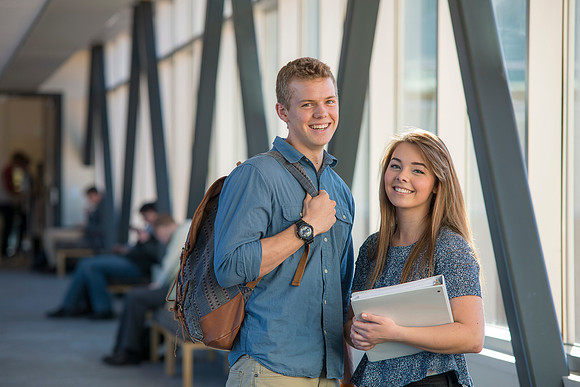 BYU-Idaho students, Collin and Martina in the Skywalk between the Manwaring Center and the McKay Library.