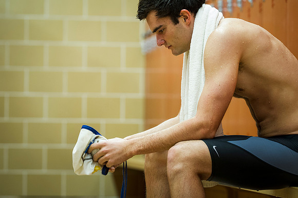 Nate mentally prepares in the locker room for his upcoming Water Polo game.