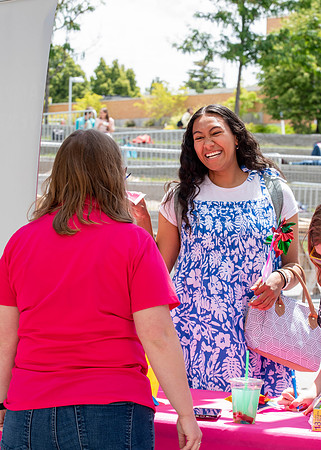 Students get free hot dogs, and enjoy activities at the Amphitheatre. IBC Business sell their products.