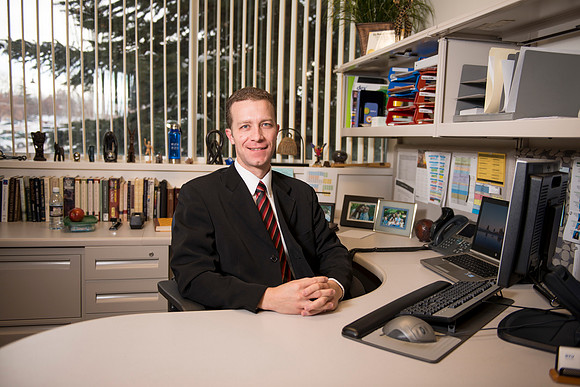Riley Hall, from Admissions in the Kimball, works in his office.