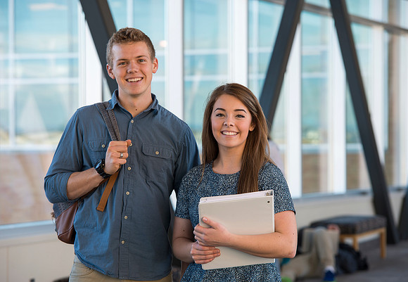 BYU-Idaho students, Collin and Martina in the Skywalk between the Manwaring Center and the McKay Library.