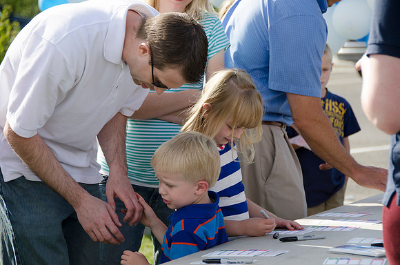 Online instructors gather with their families for an eveing of BBQ and games.