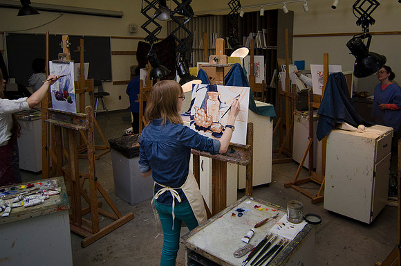 David Belka enthusiatically teaches painting principles to beginning painting class.