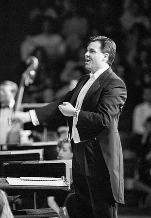 The conductor leading the Choir